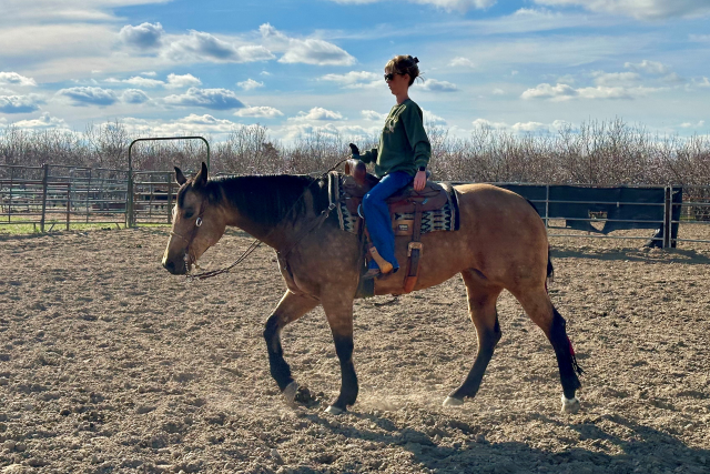 Molly Lacey loves riding horses