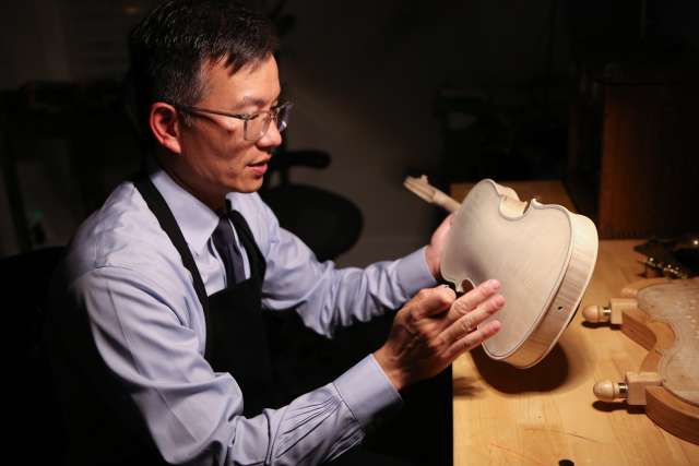 When he's not studying the brain, neursurgeon Dr. Daniel Lu is crafting world-class violins. (Photo by Anne Johansson)