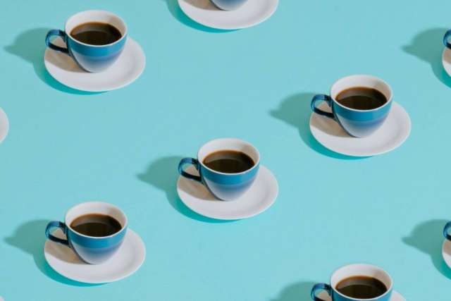 Repeating white coffee cups on turquoise background