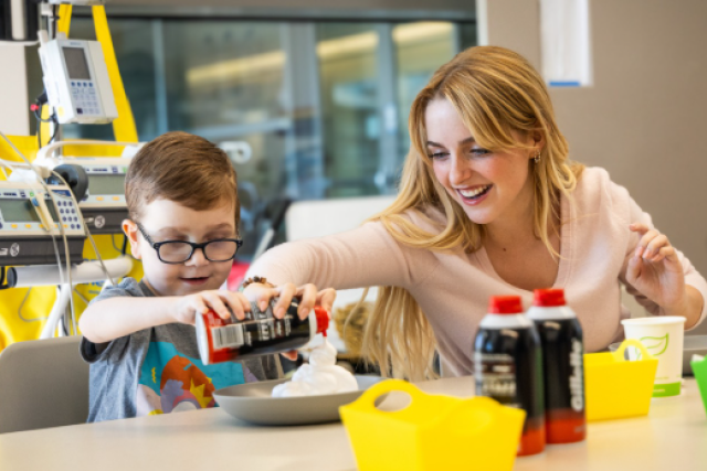 Influencer playing with a young patient
