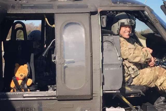 Timothy Ko sits in a helicopter while in the Army.