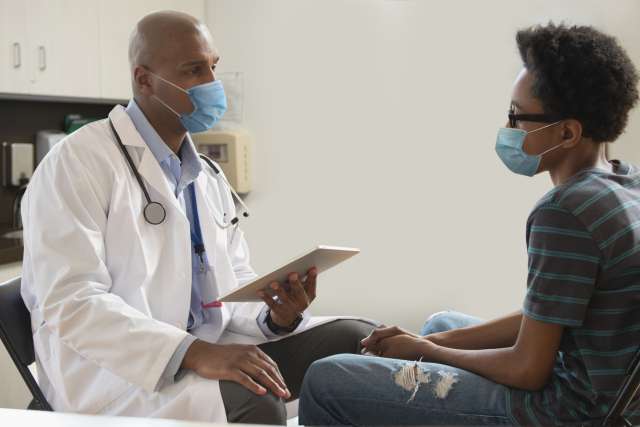 Doctor and patient discussing treatments or covid