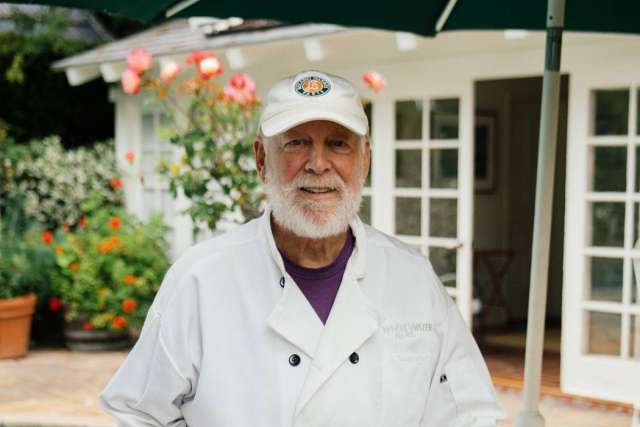 Patient with white ball cap and jacket