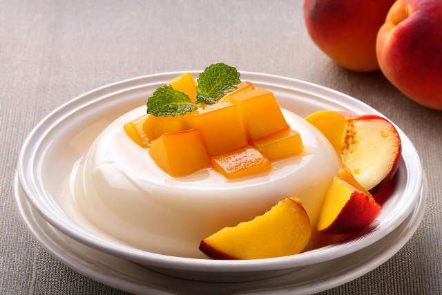 Almond Jelly with Mango on a White Plate
