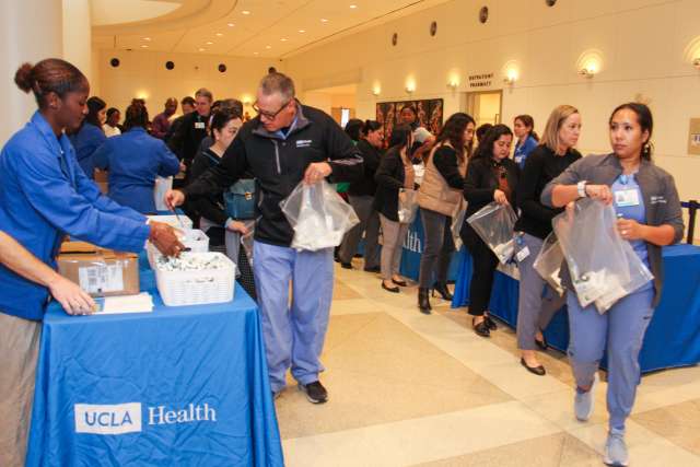 Volunteers assemble hygiene kits at Ronald Reagan UCLA Medical Center, in support of the Homeless Healthcare Collaborative.