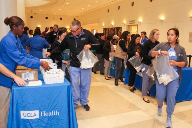 Volunteers assemble hygiene kits at Ronald Reagan UCLA Medical Center, in support of the Homeless Healthcare Collaborative.