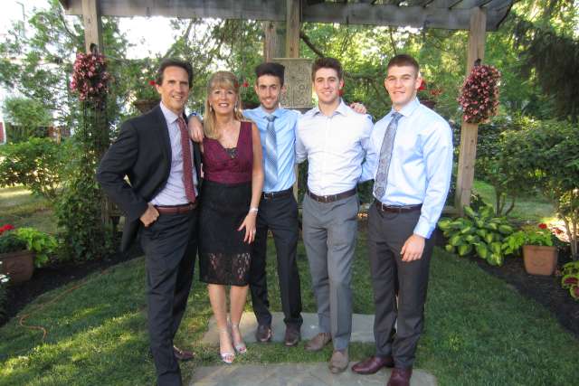 The Nelson family poses for a picture outdoors.
