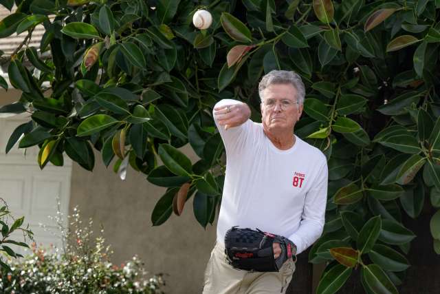 Man throwing ball outside