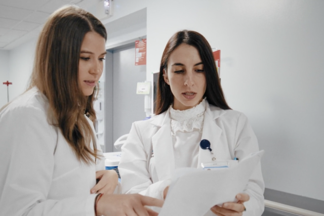 Two Mt. Sinai registered dieticians looking at a paper together.