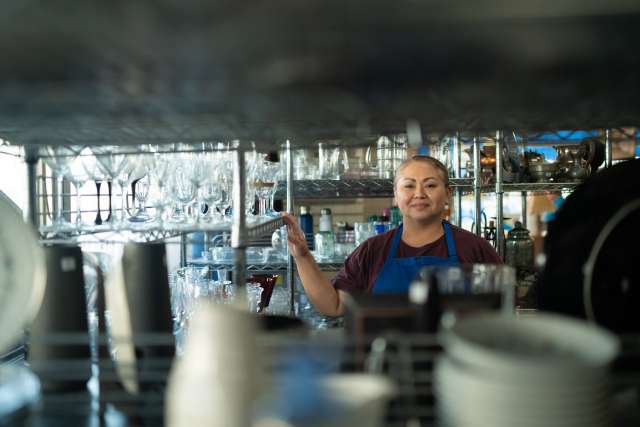 Patty Canales manages the UCLA Health Auxiliary Thrift Shop, where she's worked for 27 years. (Photo by Milo Mitchell)