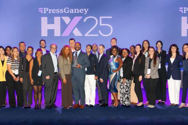 Robert Cherry receives award surrounded by family and colleagues 