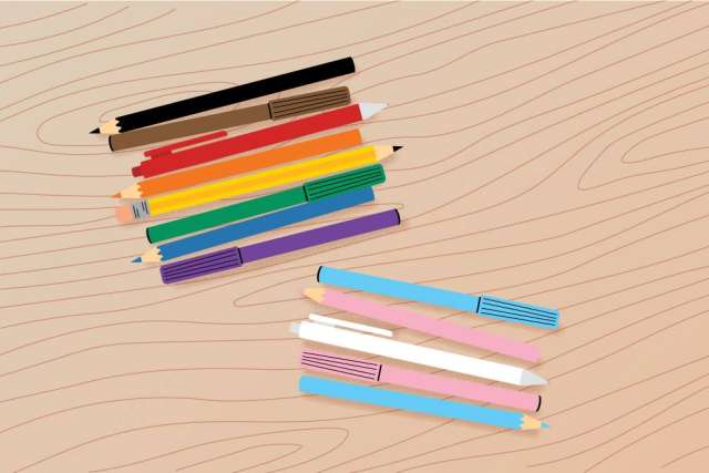 Colorful pencils arranged on a wooden surface, showcasing various hues.