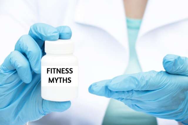Doctor wearing blue gloves and holding a pill bottle labeled "Fitness Myths"