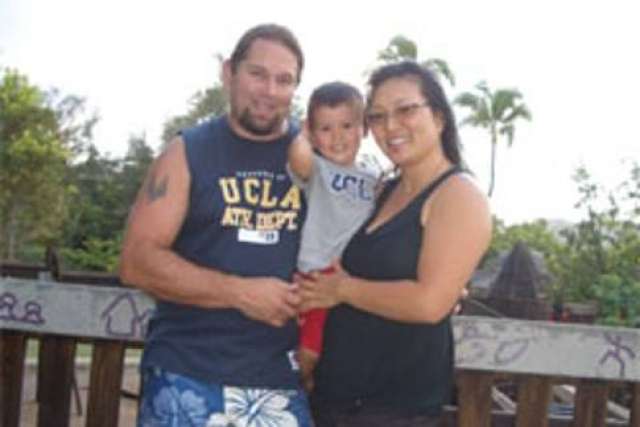 Jerry and Amy family portrait with Timmy outdoors