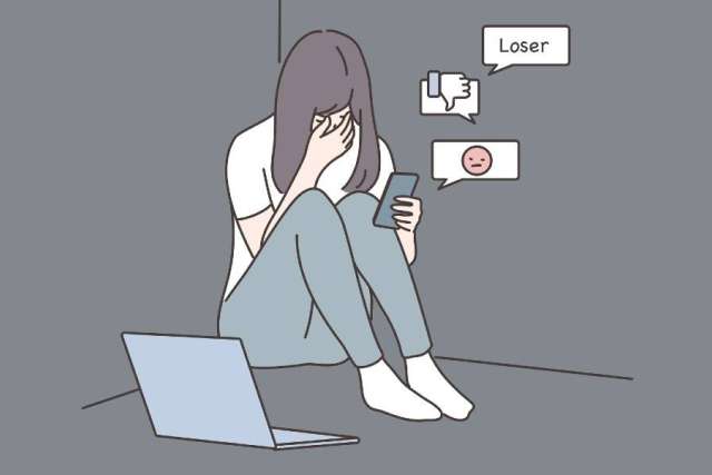 depressed teen looking at social media