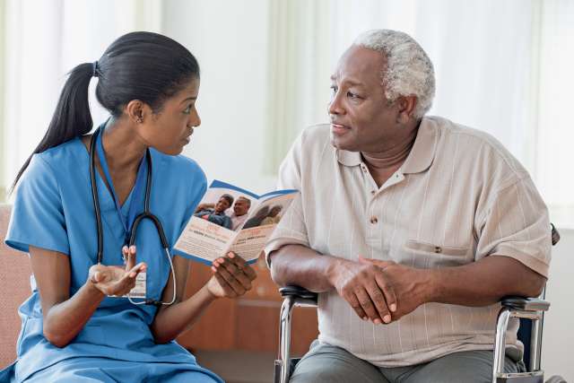 nurse and older male patient