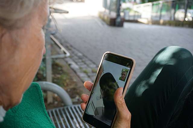 Elderly woman using virtual communication