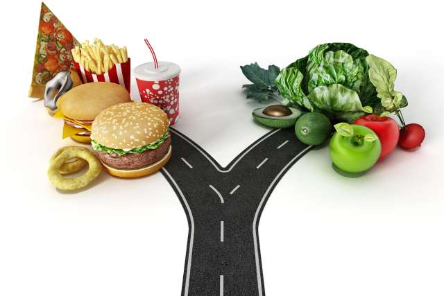 Road with a choice between fast food and healthy food.