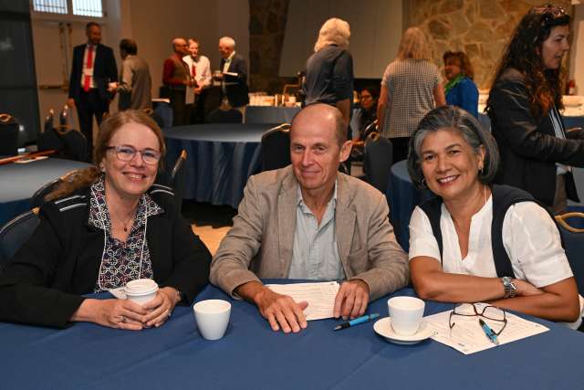 Drs. Karin Nielsen, Lorenz Von Seidlein, and Jacqueline Deen seated together at a conference marking 50 years of pediatric infectious disease work at UCLA