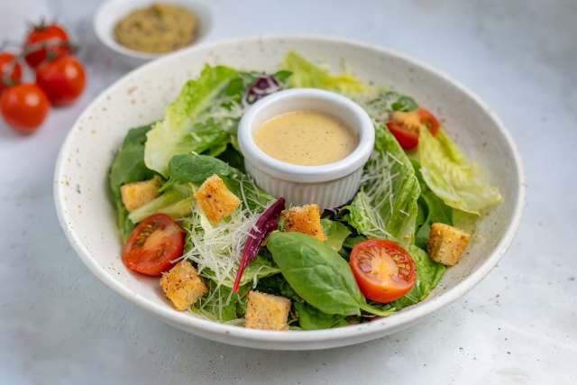 Ceasar salad dressing on a salad