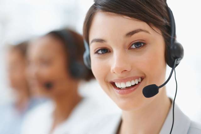 Customer service representative talking with headset with mic