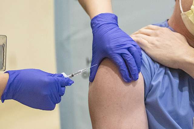 Patient receiving COVID-19 vaccination