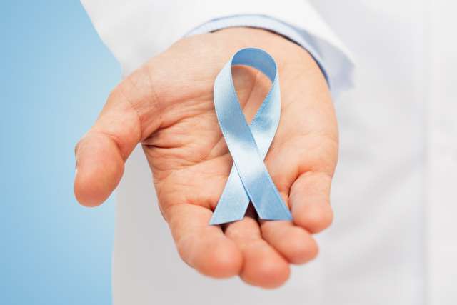 doctor hand with prostate cancer awareness ribbon