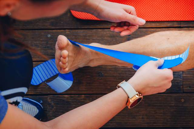 Medical taping for leg correction after sport injury