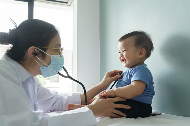 Doctor listening to a baby's breathing