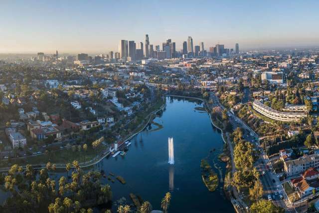 An expansive birds eye view of the LA cityscape in the evening