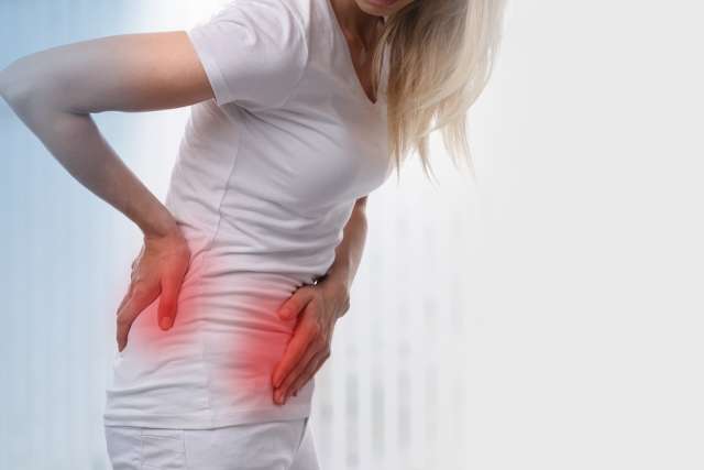 Woman experiencing kidney pain