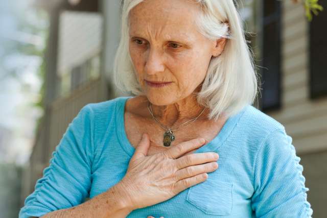 OIder woman feeling chest pain