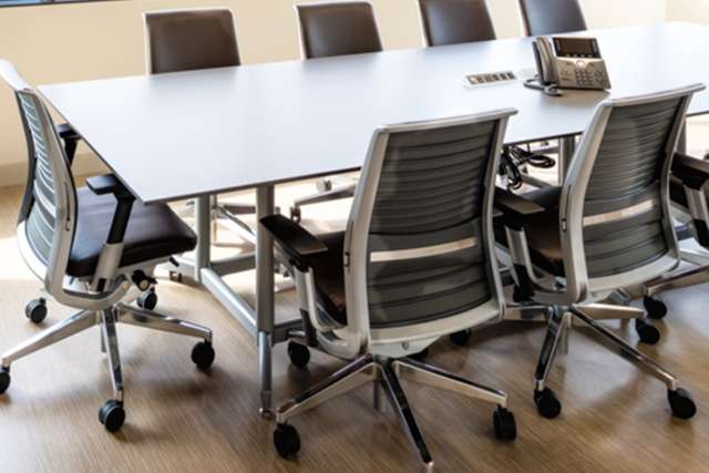 Conference table with ergonomic chairs 