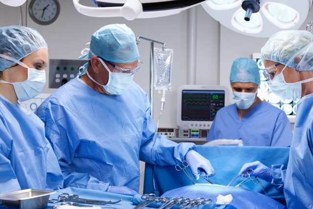 Surgical team performing operation