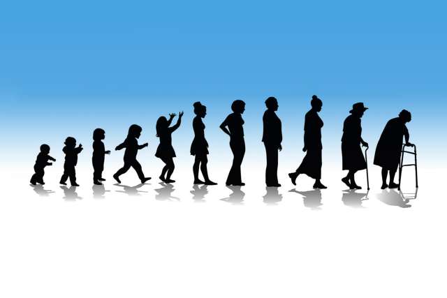 Silhouette of aging stages from infant to elderly woman