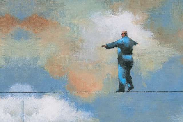 Man walking tightrope