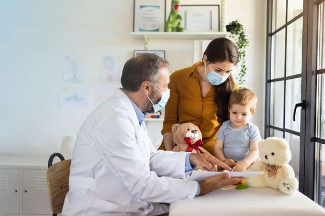 Child with mother and Pediatrician