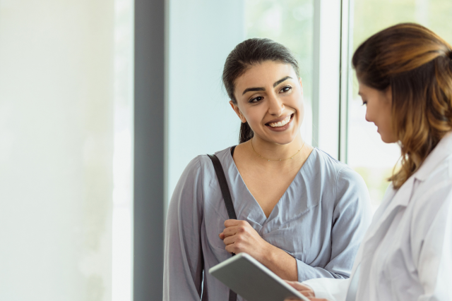 Smiling woman visiting gynecologist