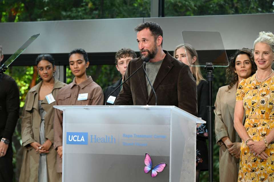A speaker stands at the podium for the Rape Treatment Center Annual Brunch