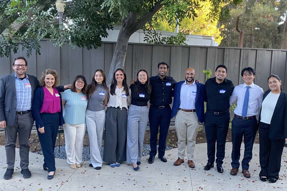 A group of MSTAR Students and Faculty outdoors smiling