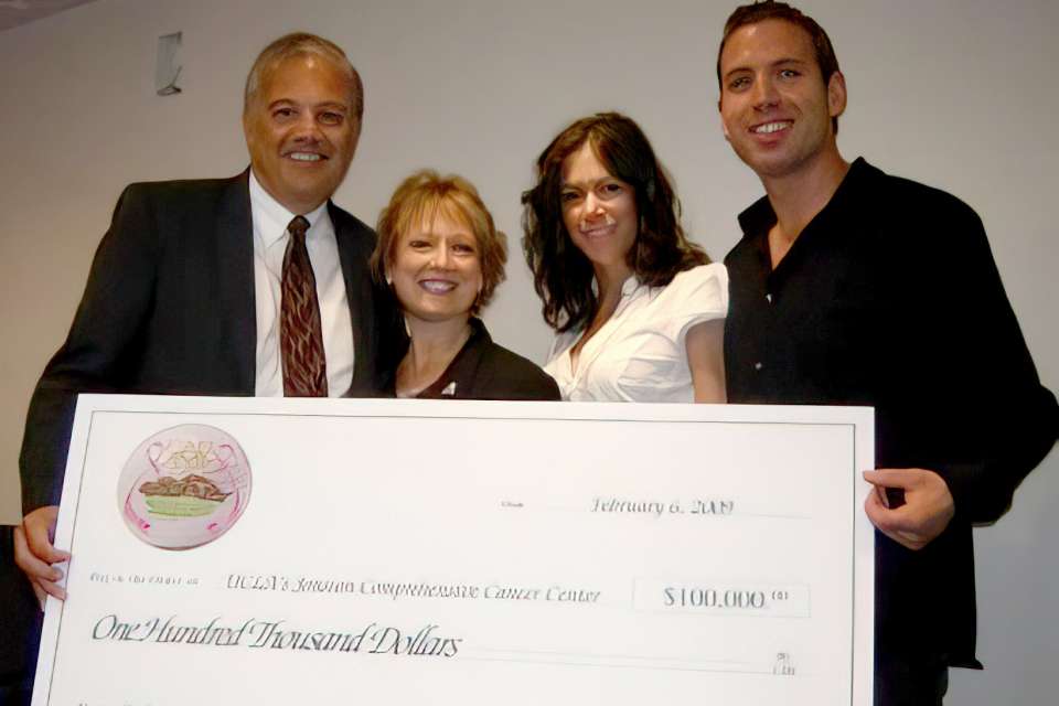 JoAnn Esposito with supporters at check presentation for Par for the Cure
