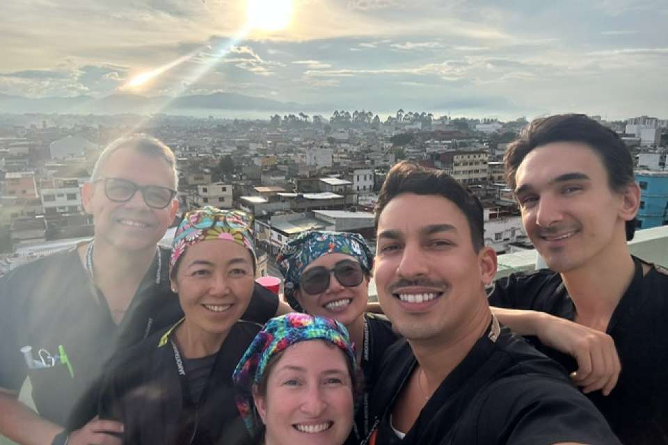 Pictures of clinicians in Guatemala City with landscape in background