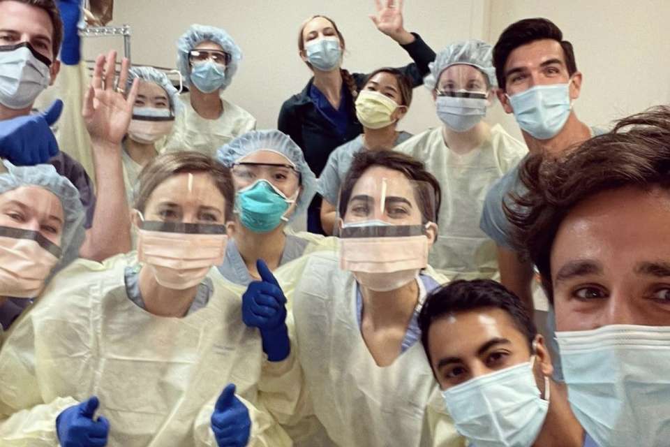 group photo of dermatology residents in anatomy lab
