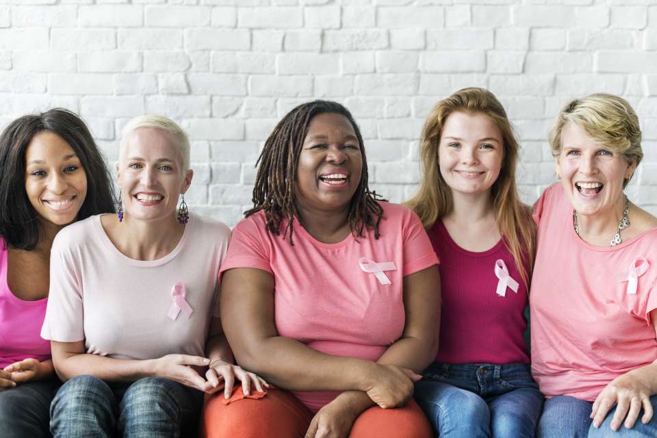 Breast cancer survivors sitting together
