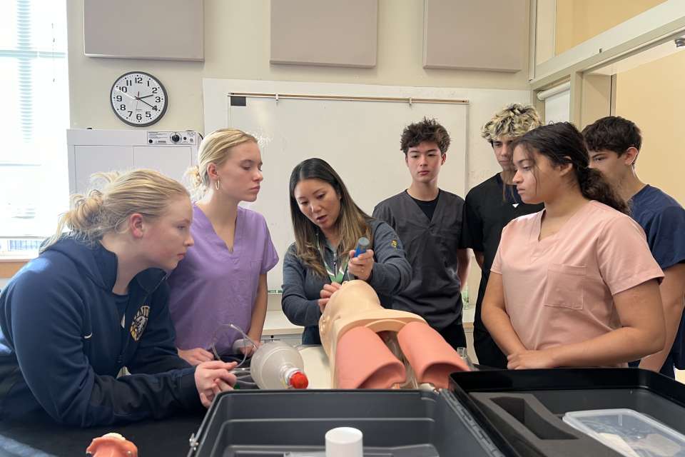 Dr. Sandra Sacks demonstrating to Project Lead the Way students