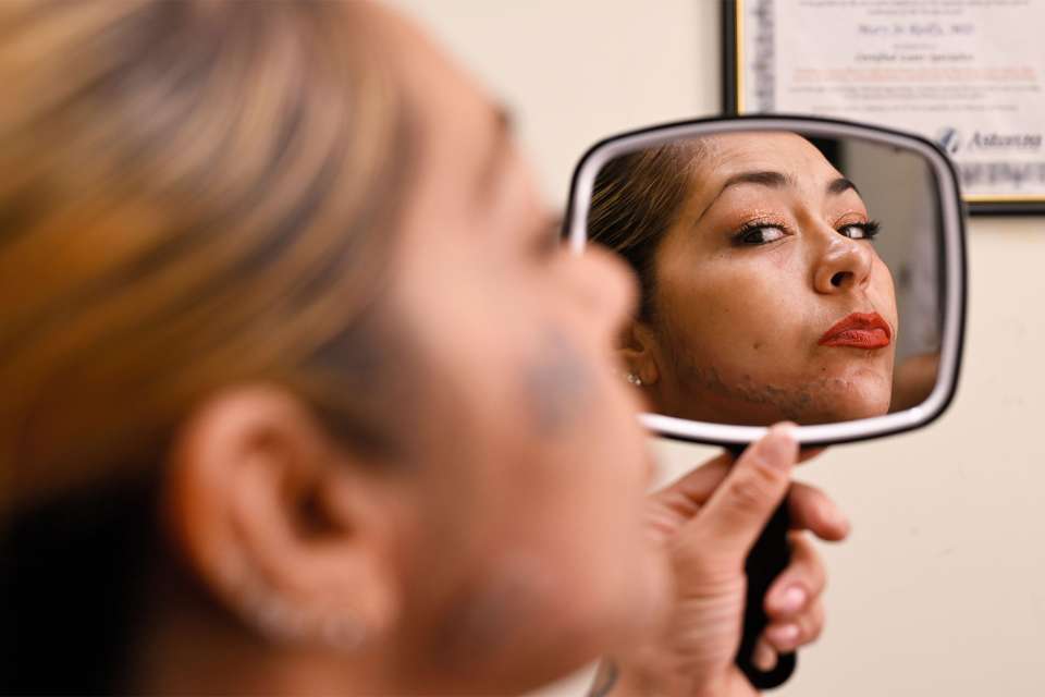 Reyna Garcia checks out her new look after a session with Dr. Reiss