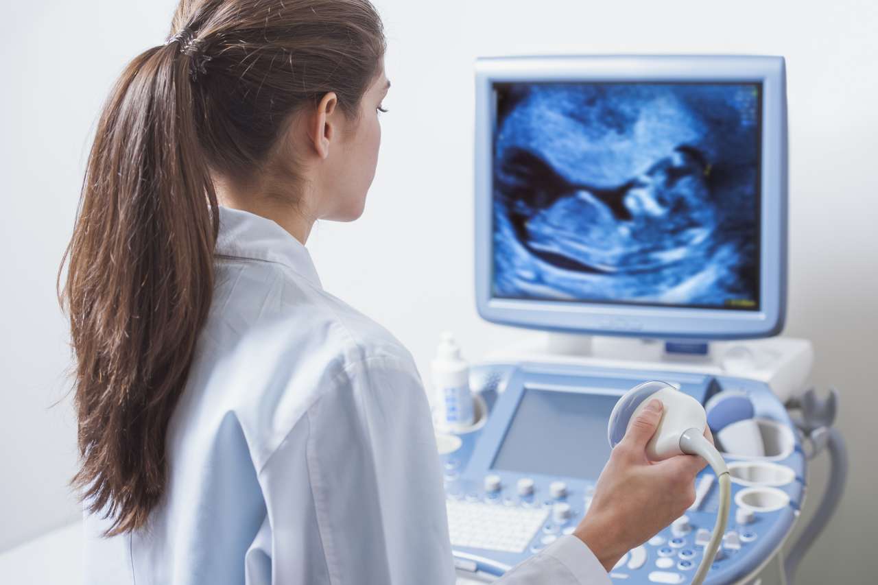 Female Doctor Performing Ultrasound