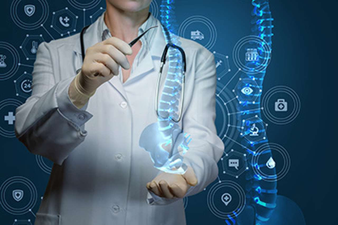 Doctor with virtual image of spine
