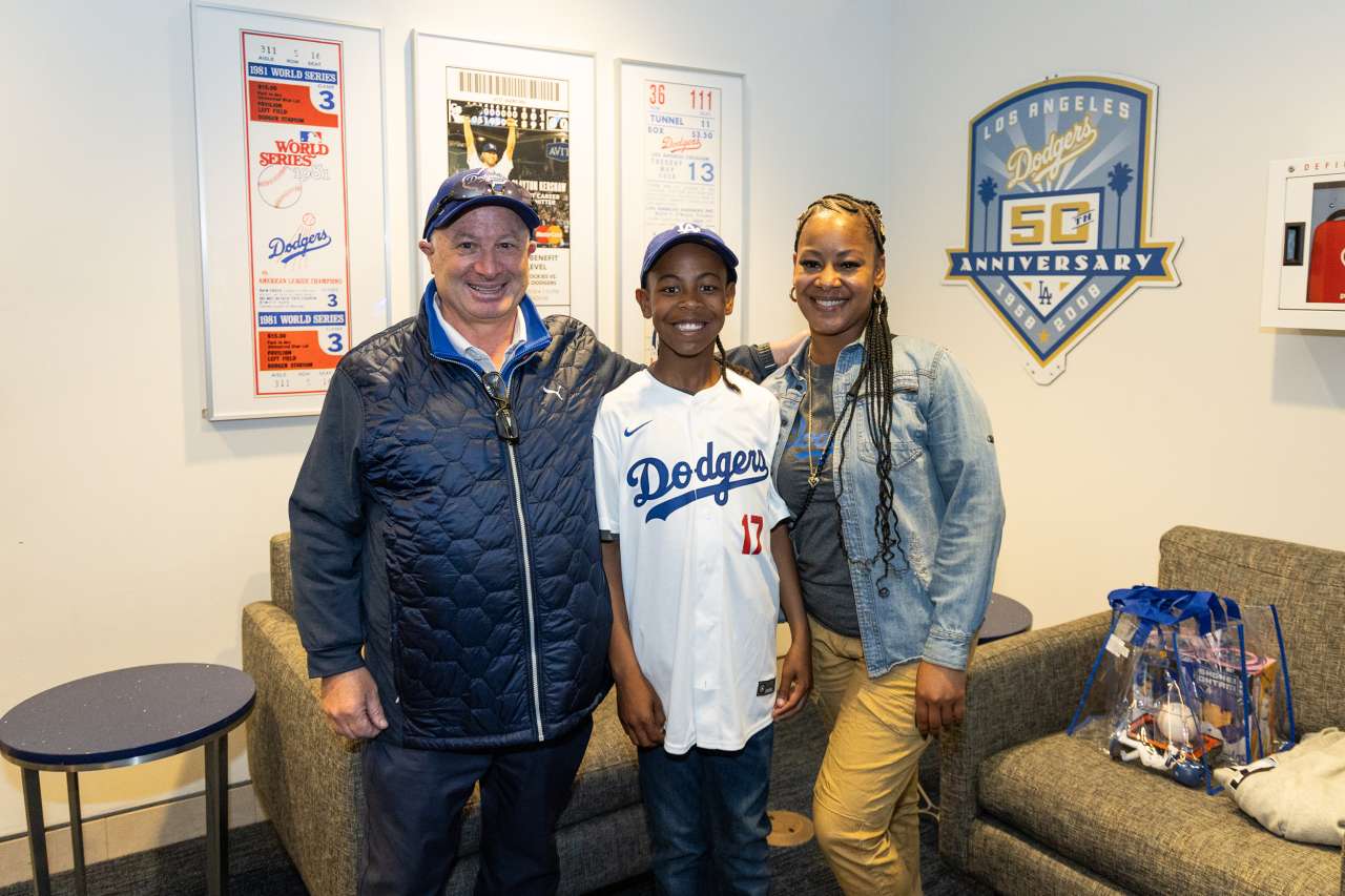 UCLA Health cardiac surgeon, Gary Satou, MD visits his patient, Albert Lee at Dodger Stadium