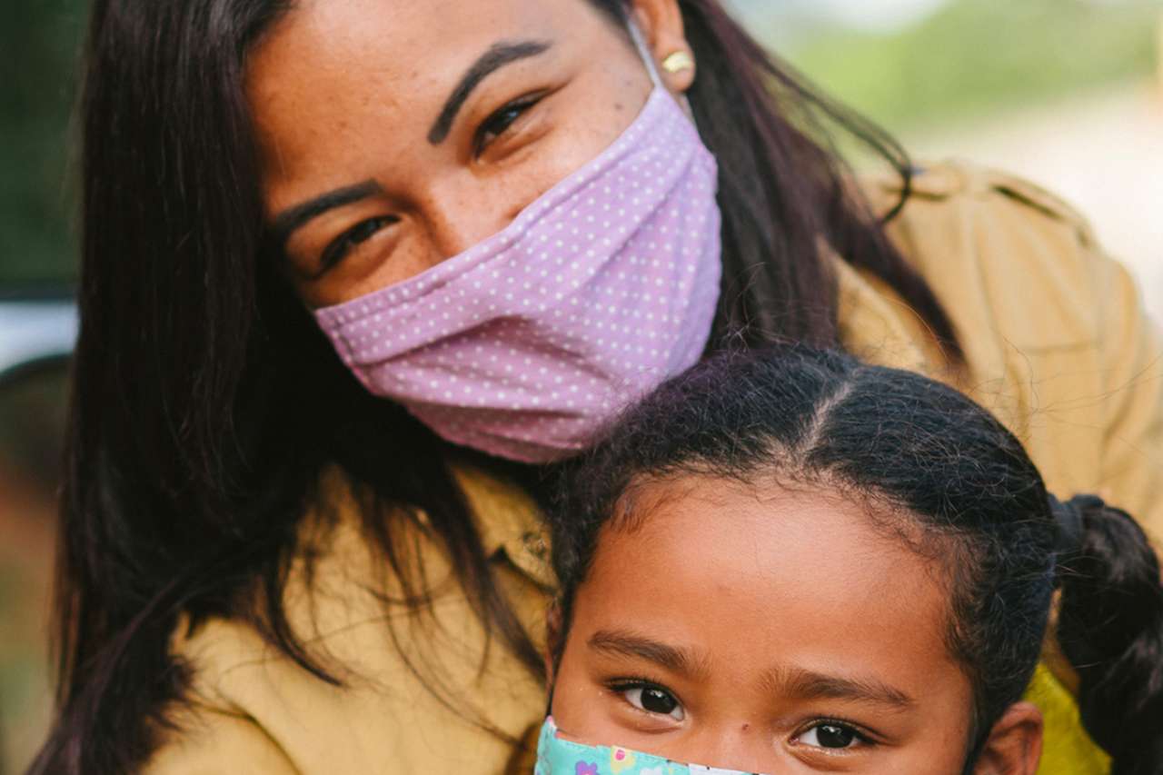 Mother and daughter with face masks